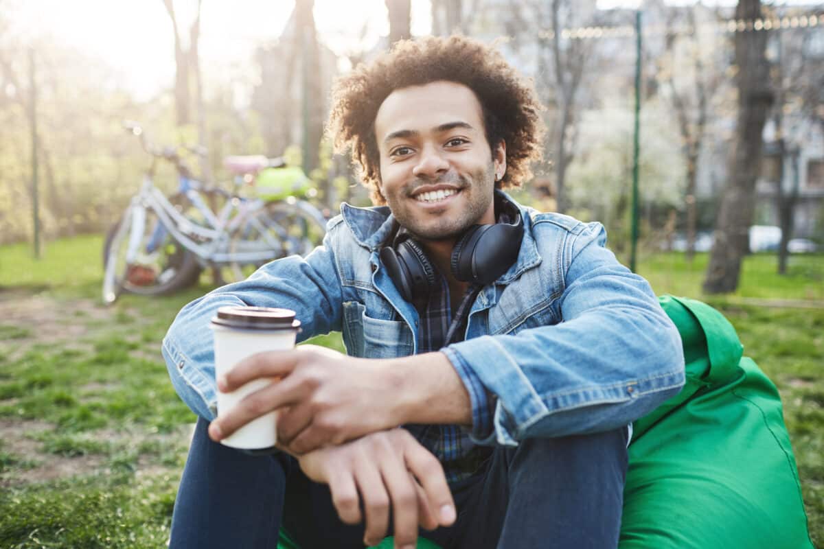 Happy and positive young male student