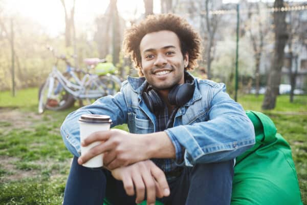 Happy and positive young male student